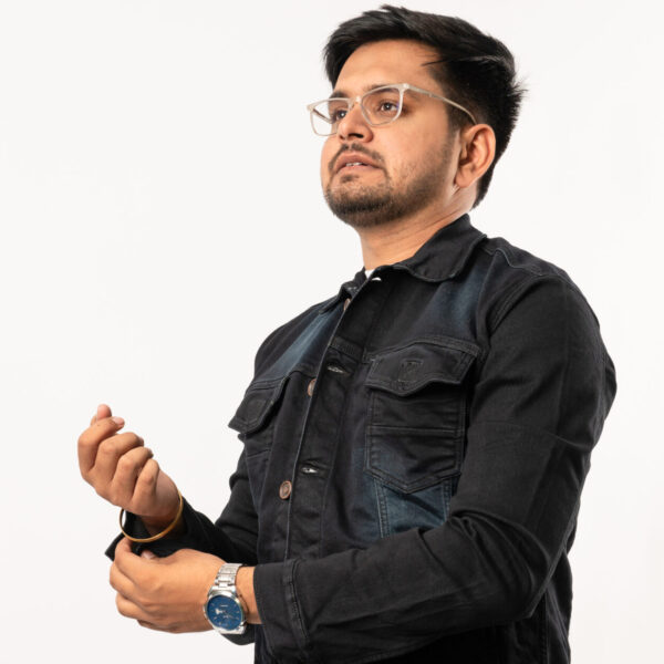 a man wearing glasses and a black jacket