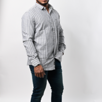 a man standing in a striped shirt